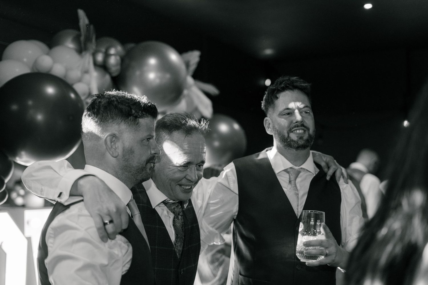 Father of the bride dancing with the groom during the wedding reception in Torquay, Devon.