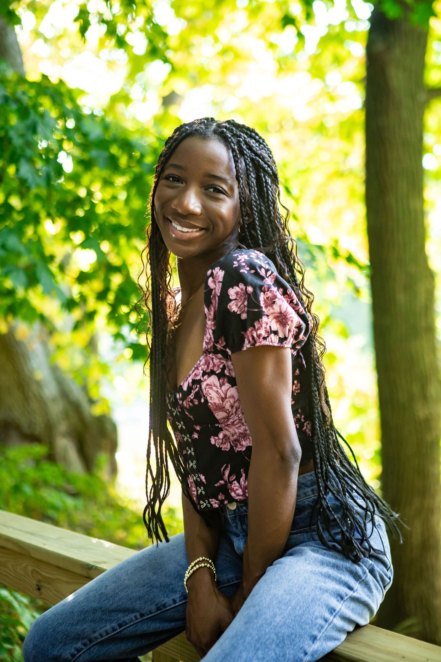 A series of outdoor portrait shots showing a joyful expression and casual style against a sunlit natural background.