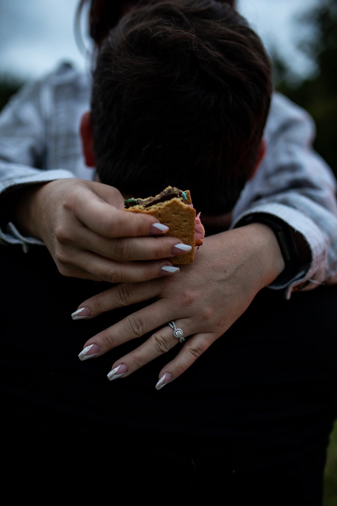 Sequential photos showing hands with an engagement ring in dim lighting.