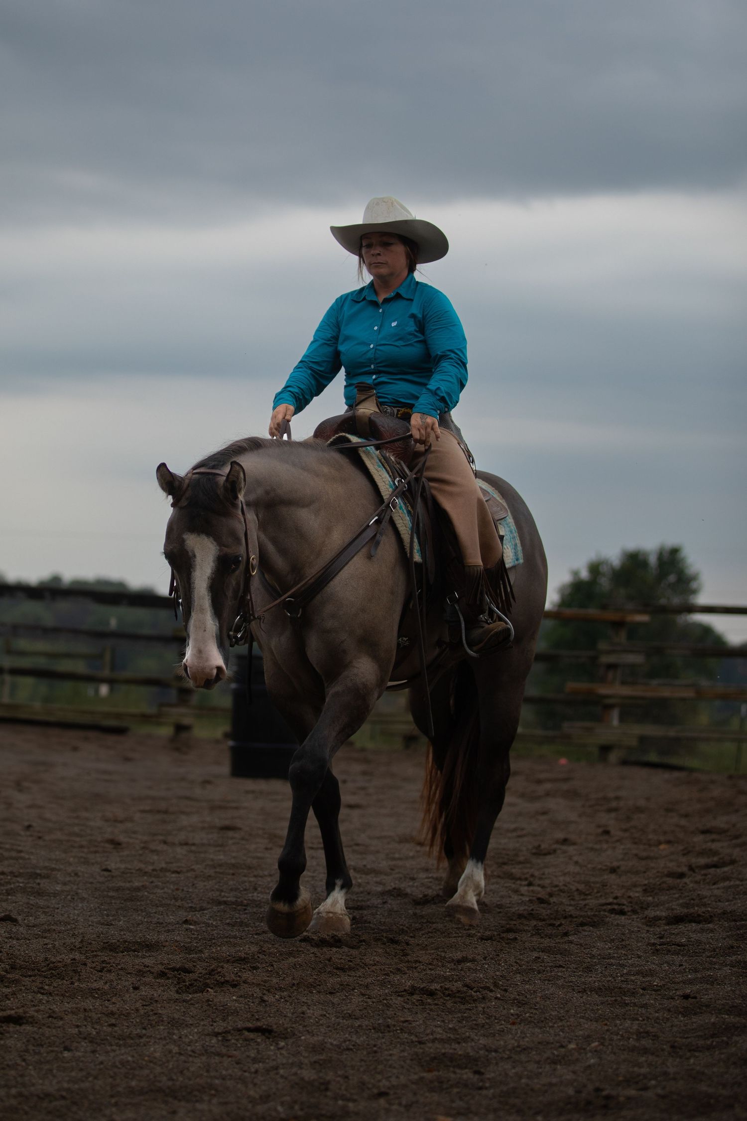 cowgirl riding horse