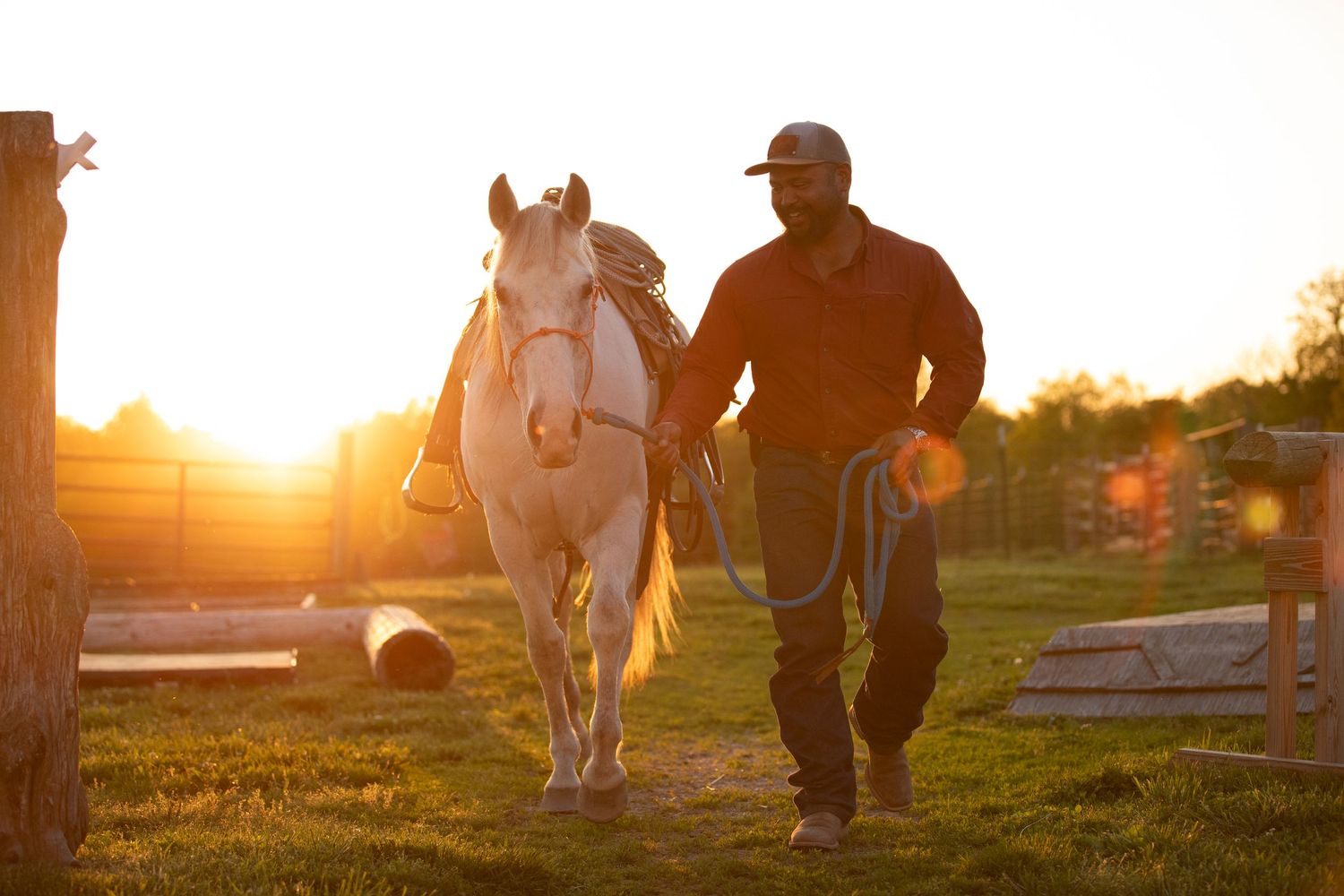 man and horse sunset