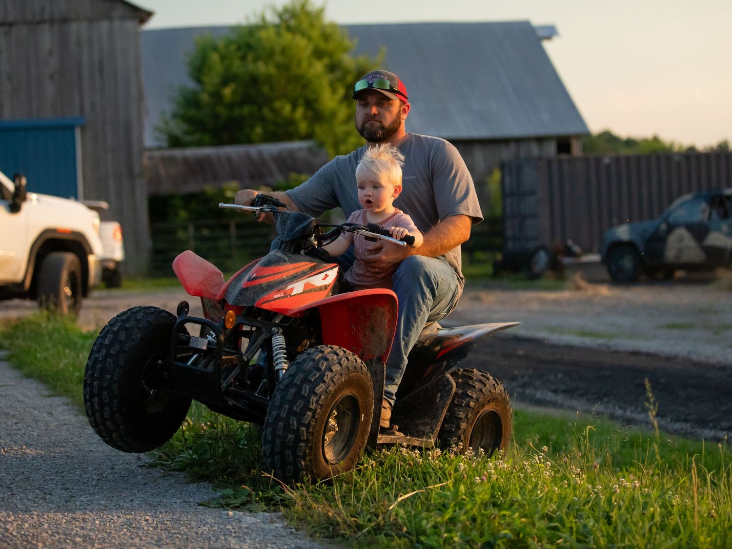 dad and son on  four wheeler