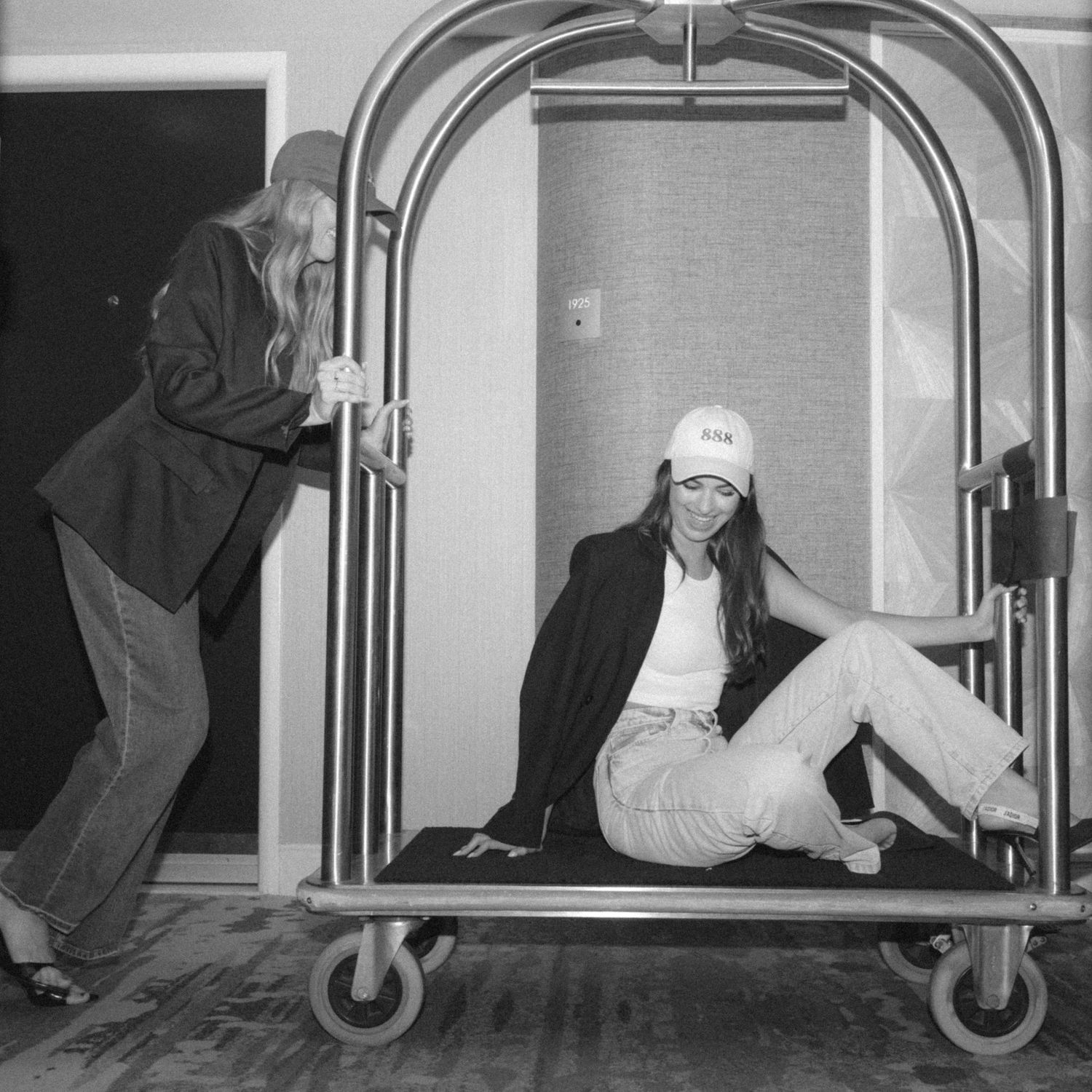A sequence of black and white photos showing someone rolling and crawling under a low metal bar.