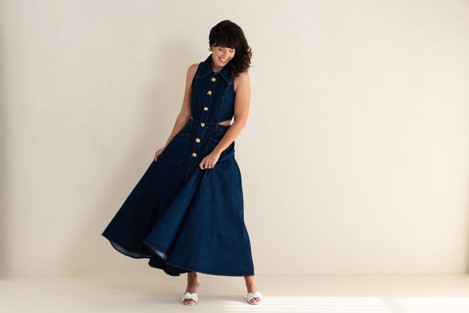 A navy blue button-down dress with a full skirt is styled in multiple poses against a white background.