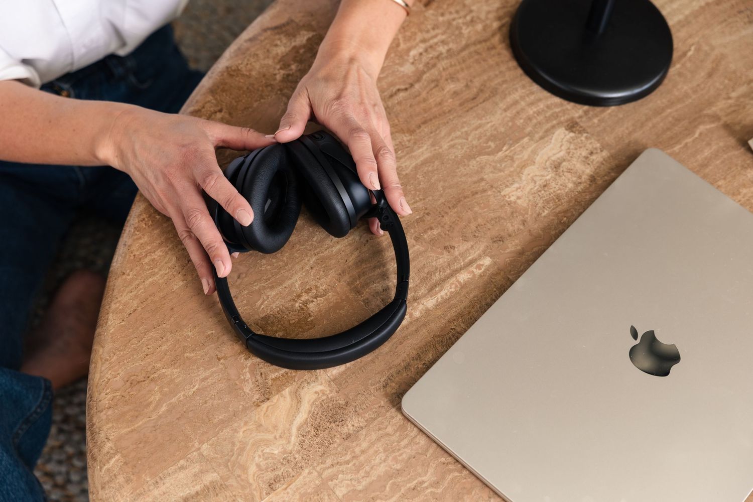 Close-up sequence showing setup of electronic equipment on wooden surface.