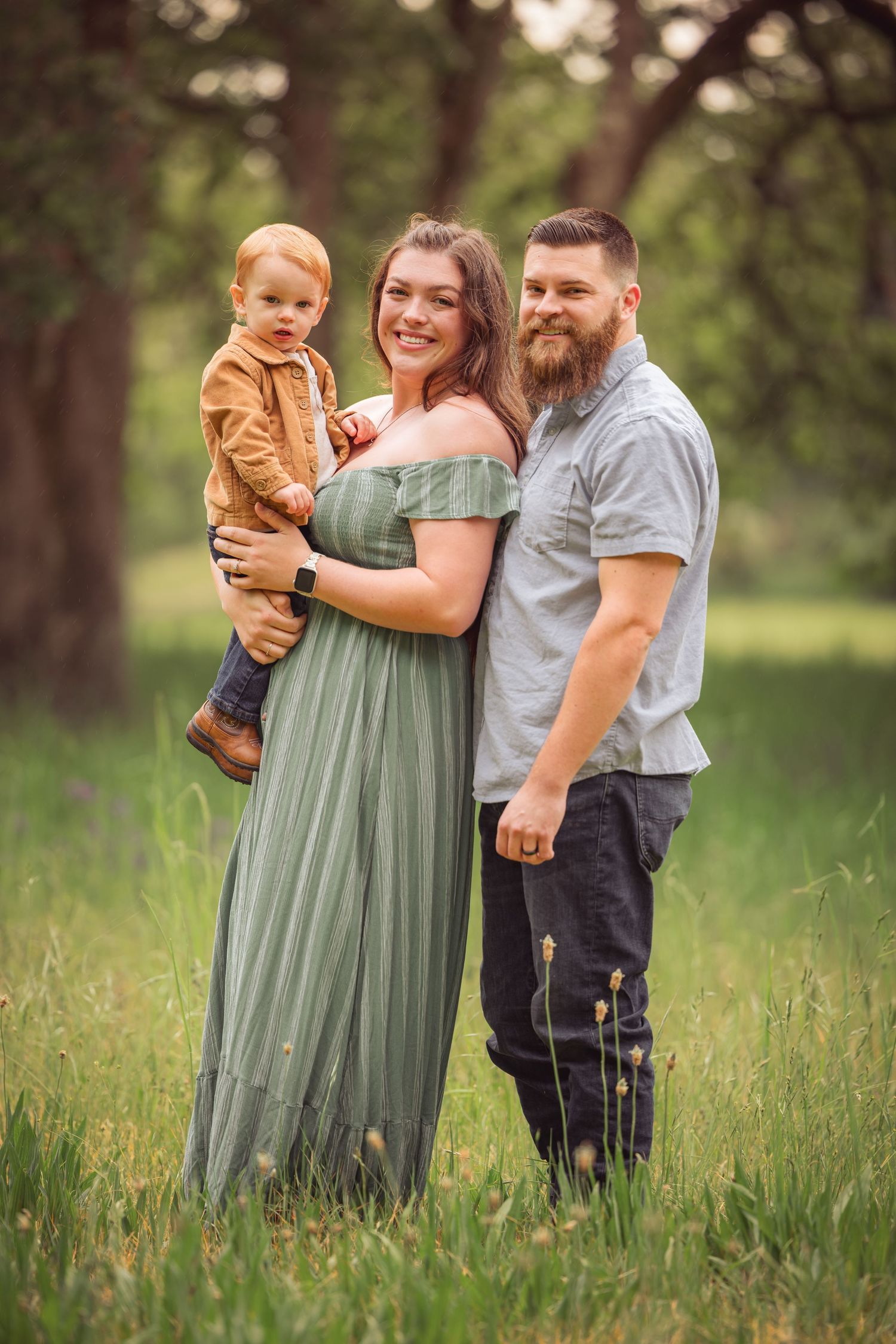 A family portrait sequence in a grassy field during a photo session taken by Salem, Oregon family photographer.