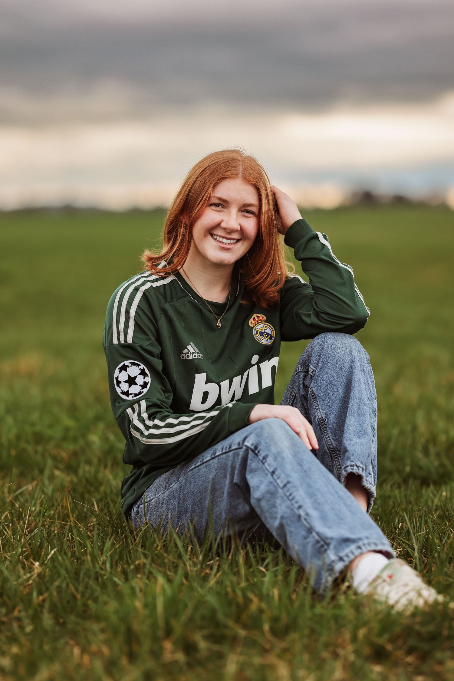 Casual senior portraits showing someone in a green soccer jersey during a photo session taken by Salem, Oregon senior photographer.