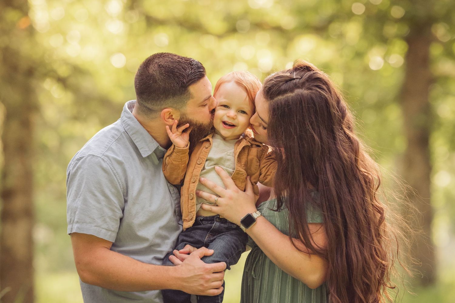Candid family moments captured in natural outdoor setting.
