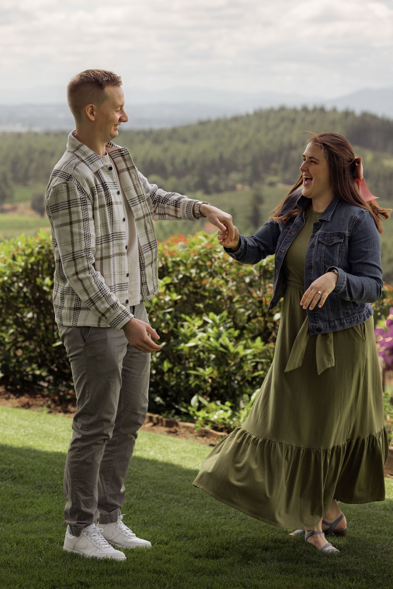 A heartwarming sequence showing reaction shots of a surprise proposal at a scenic vineyard overlook.
