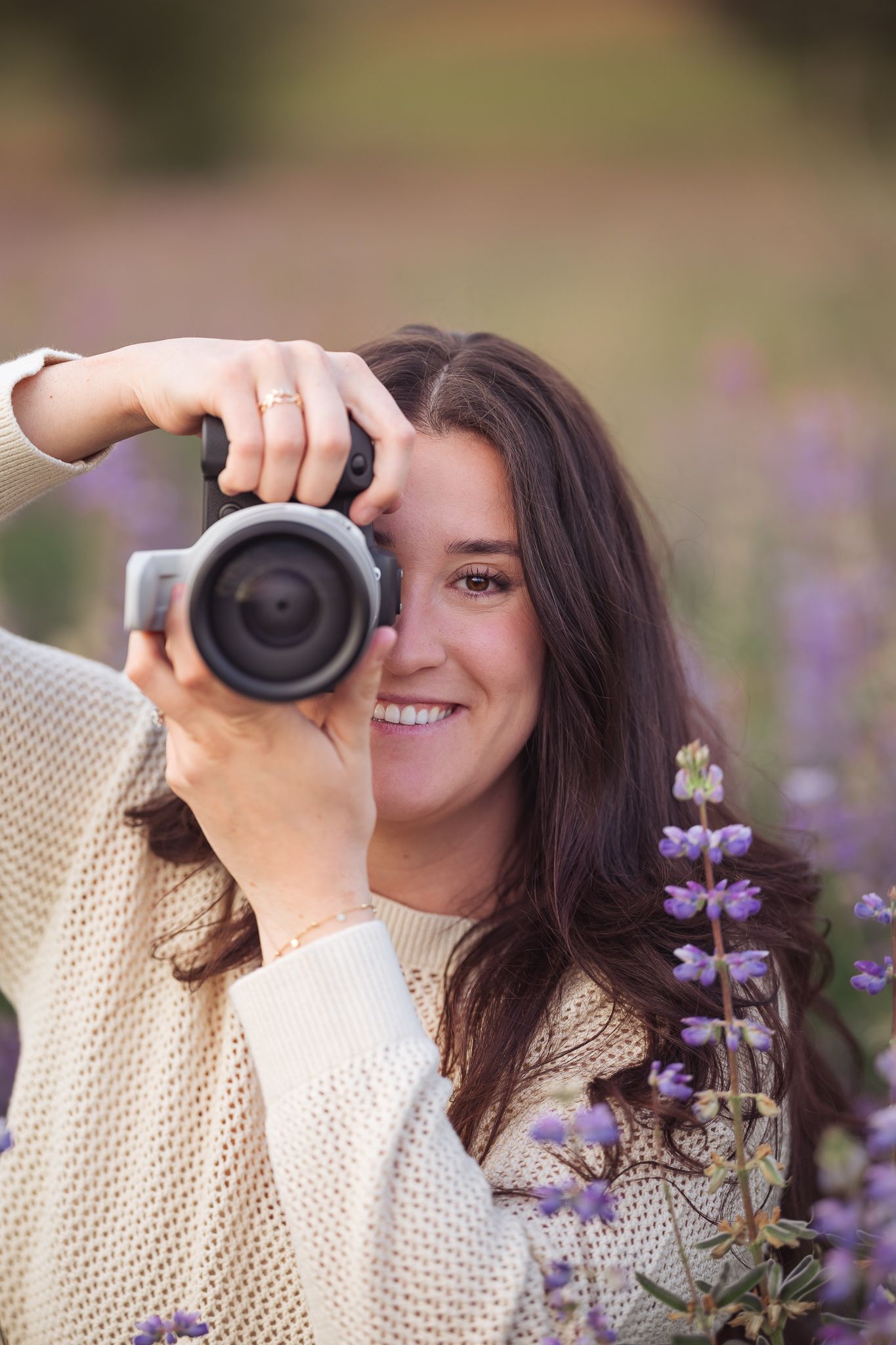 Photographer captures images among blooming purple lupine flowers.