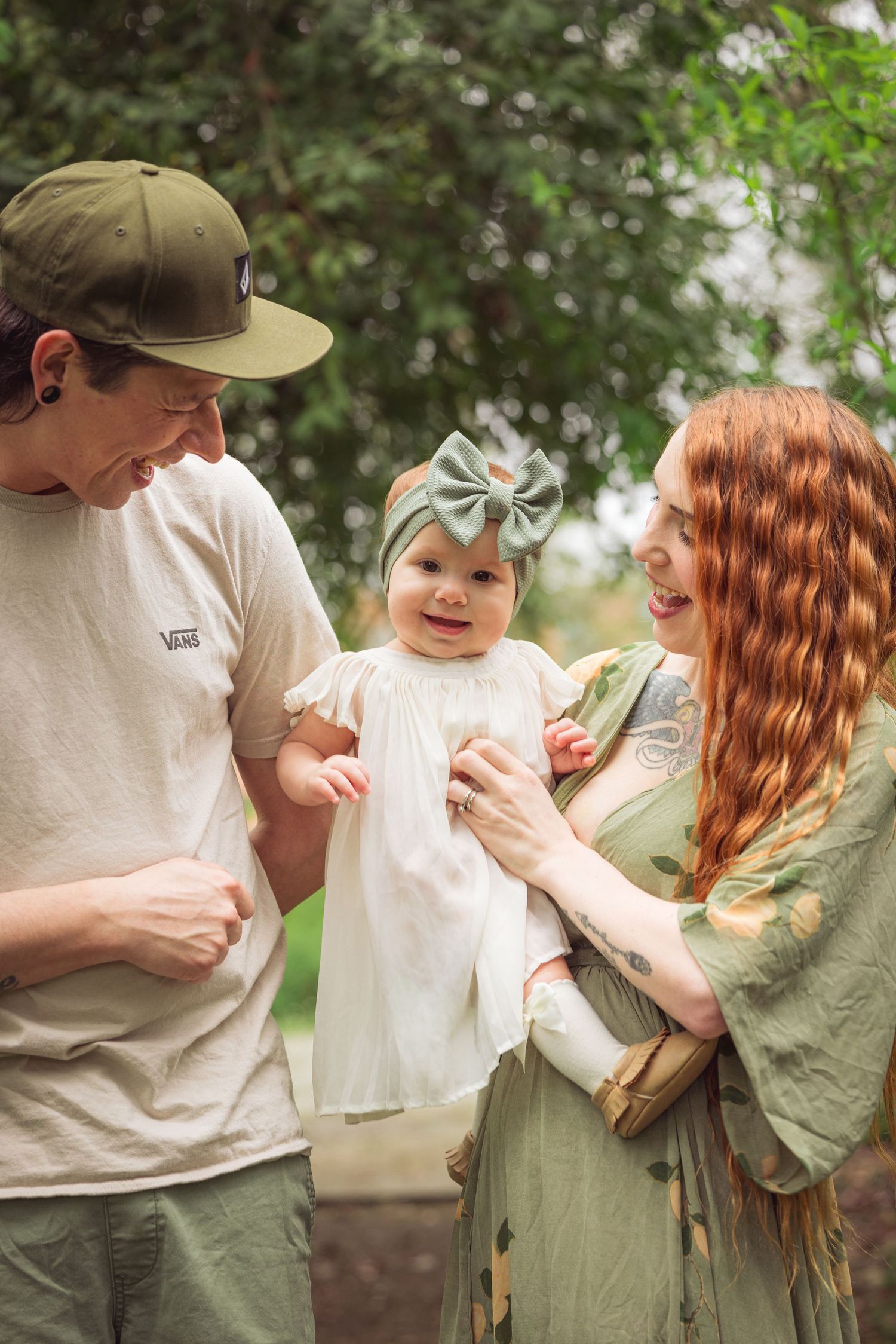 Family sharing joyful moments together outdoors in casual attire.