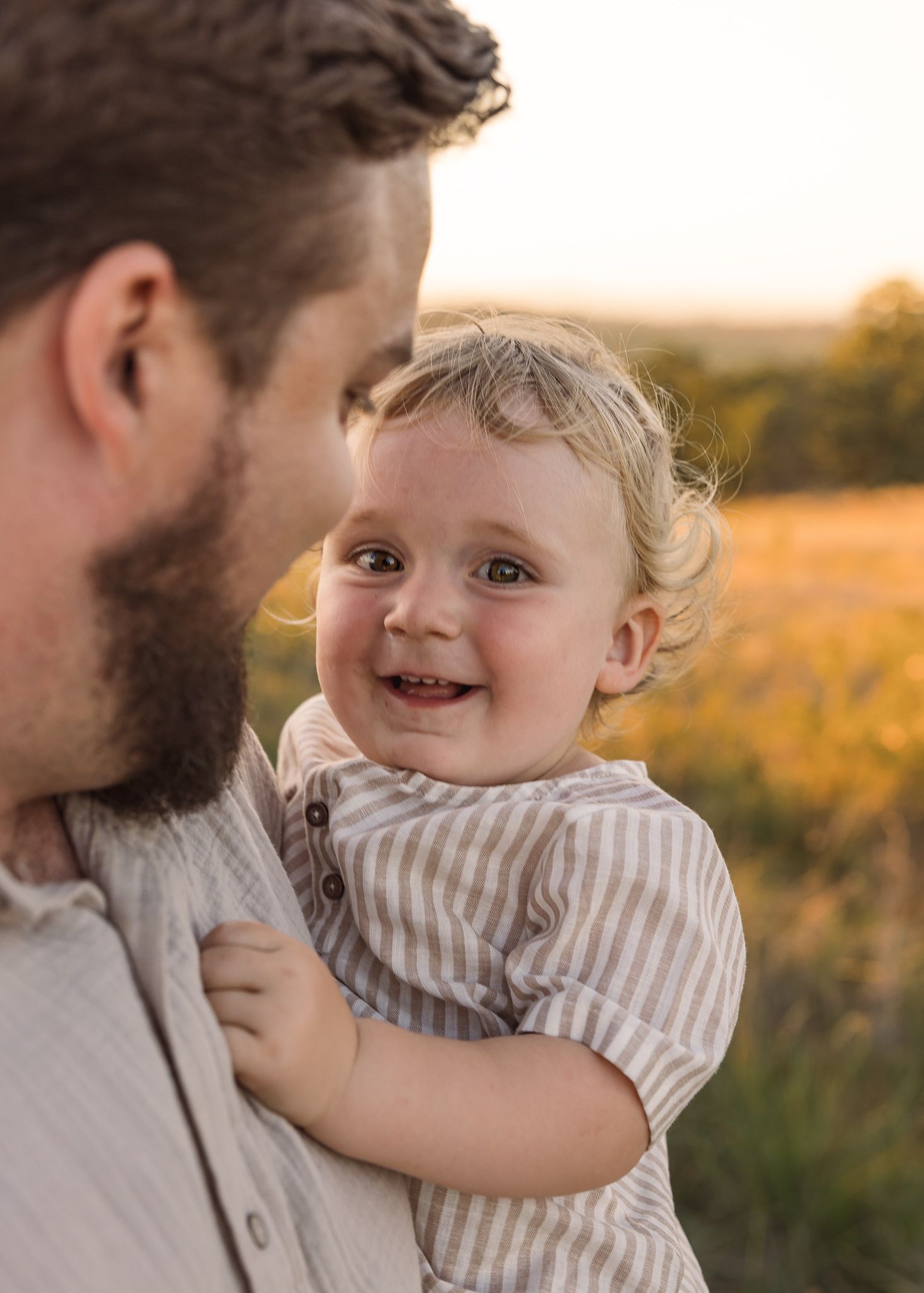Sweet interactions between parent and child during golden hour portrait session taken by Salem, Oregon family photographer.