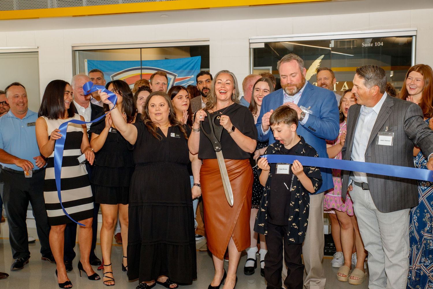 Event Photography done by Jordan and Kaesha Photography in OKC for Titan Titles Ribbon Cutting Ceromony.