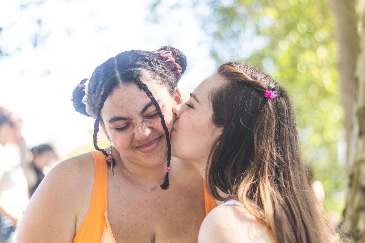 A young queer lesbian couple celebrates pride together.