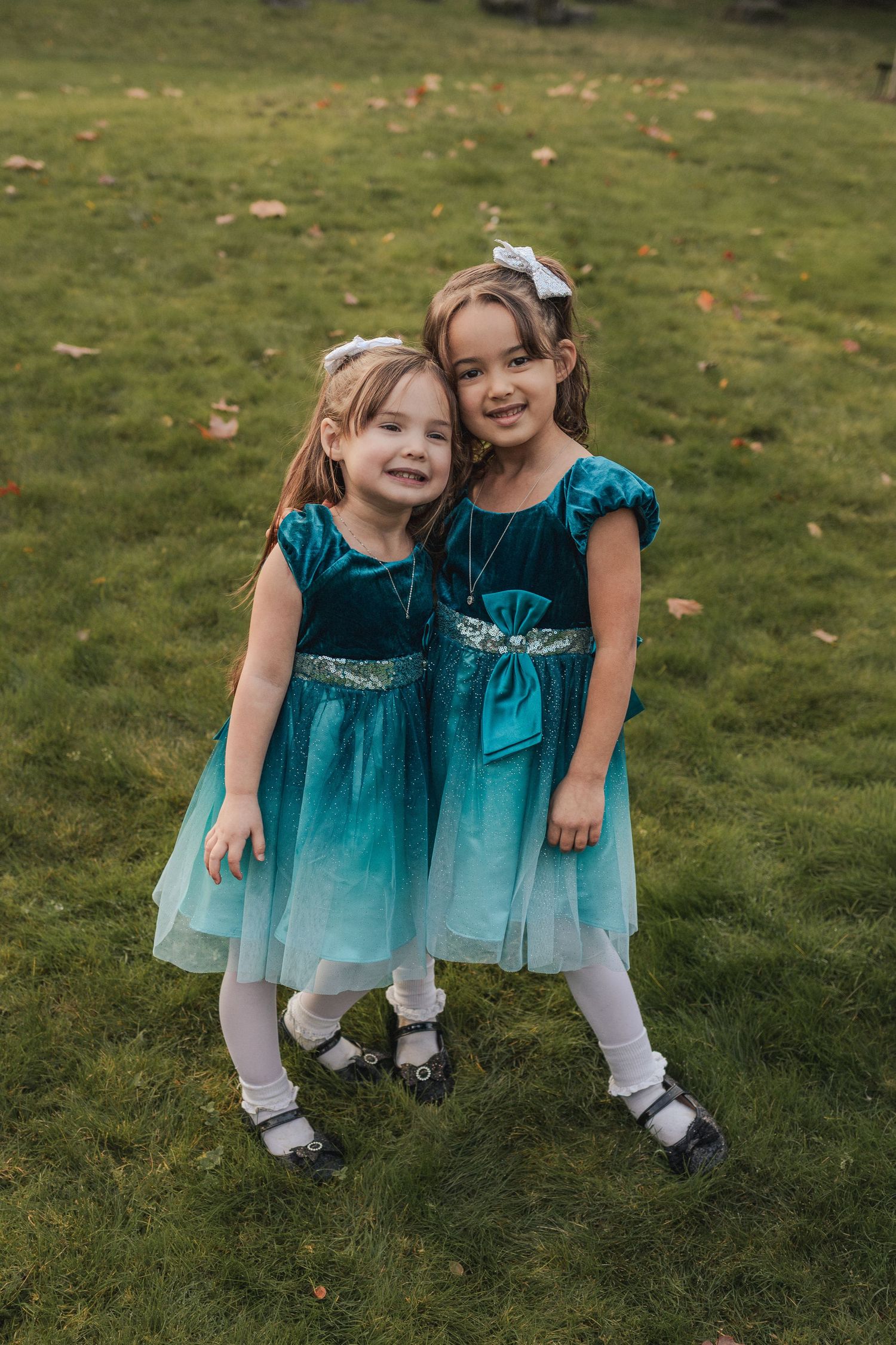 Big sisters pose together happily.