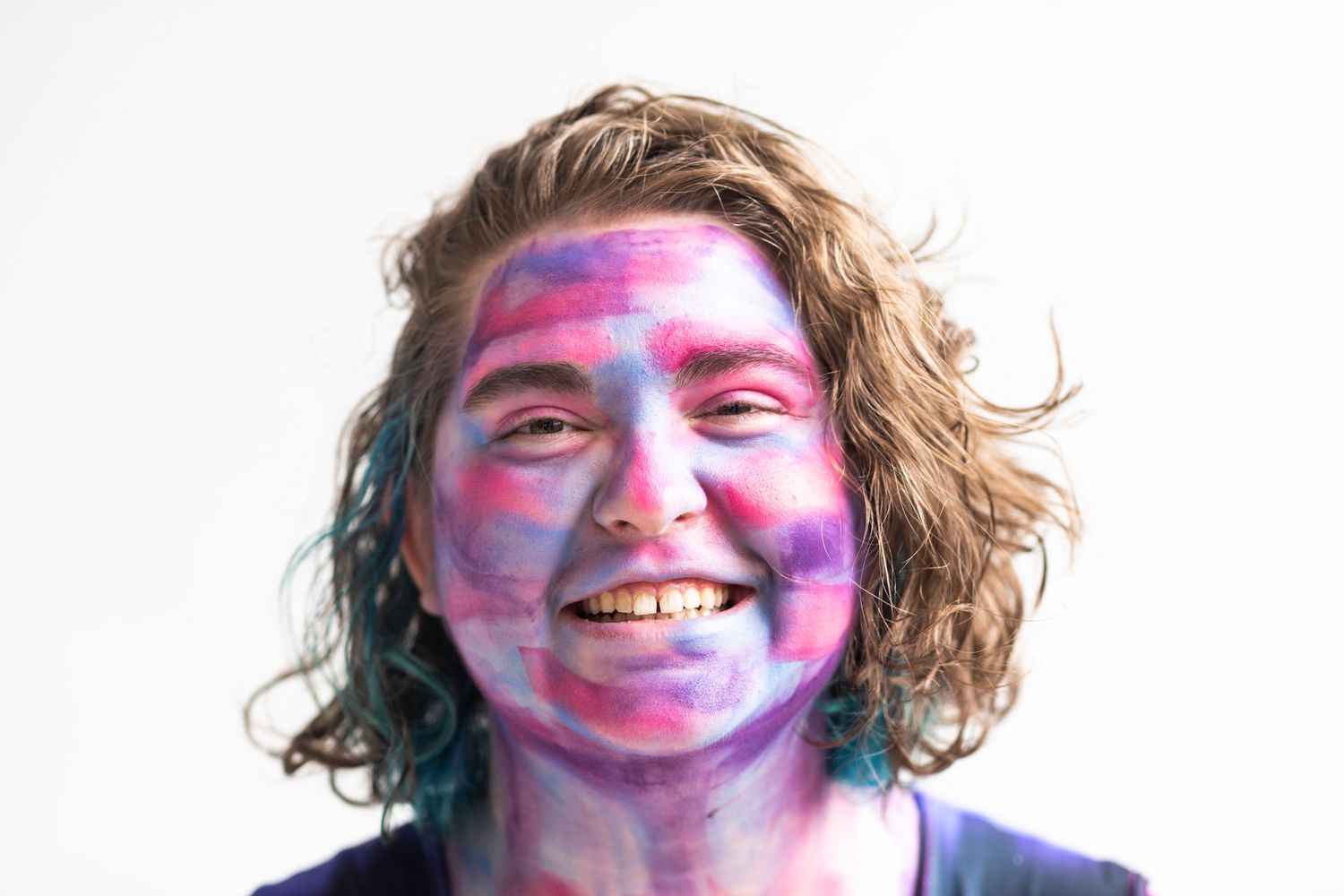 Painted blue, purple and pink, they smile for the camera.