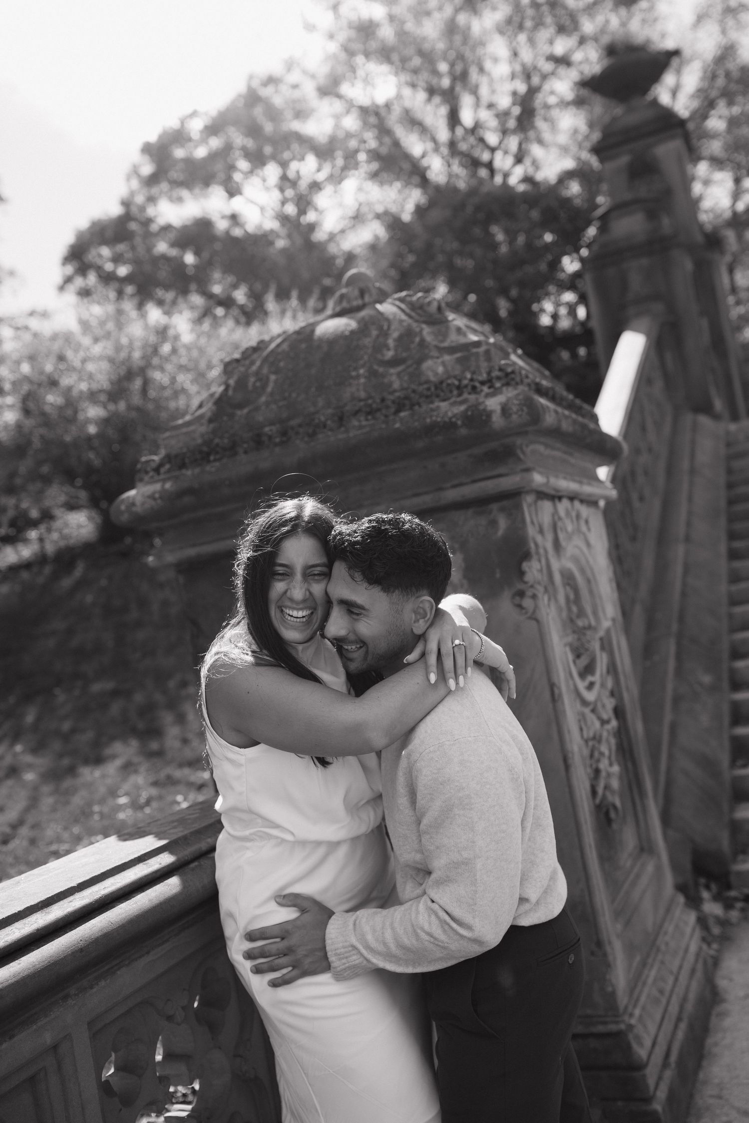 A series of black and white romantic photos showing a couple embracing on a park bench.