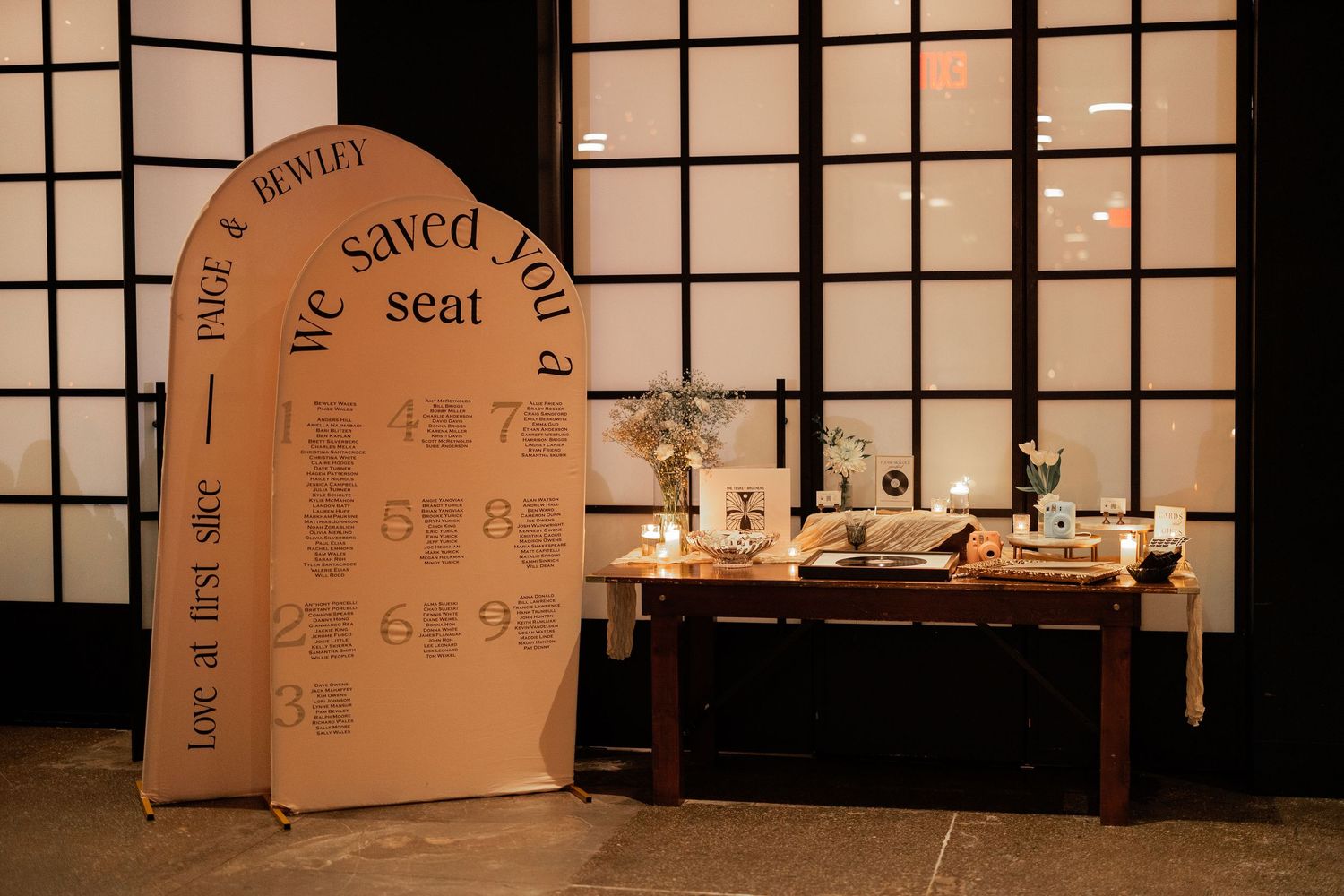 A modern wedding venue with geometric window panels and minimalist decor creates an elegant ambiance.