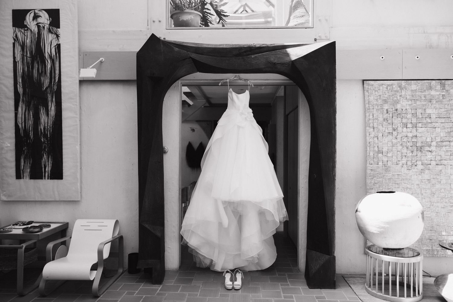 Classic white wedding dress displayed in various elegant poses against light interior backgrounds.