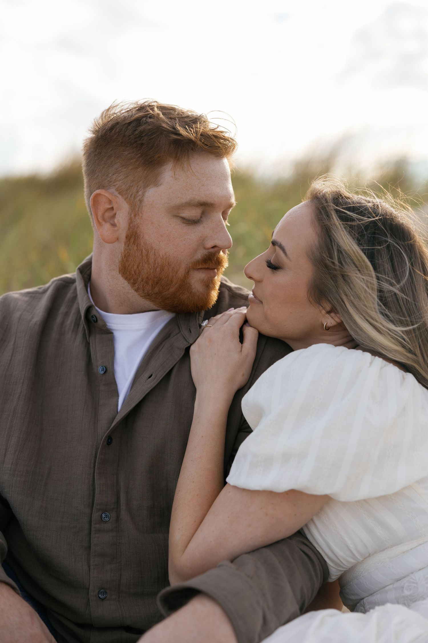 Romantic couple shares intimate kisses in a series of close-up photos against a natural outdoor background.