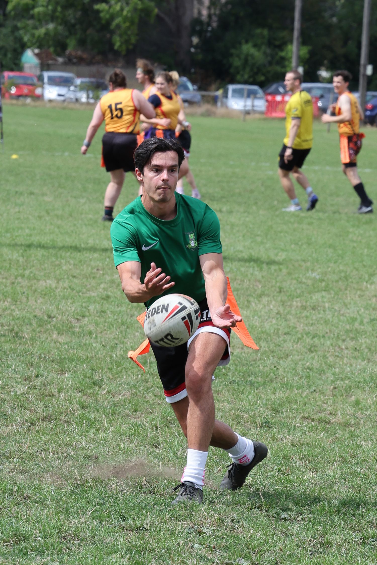 Man passing a rugny ball mid game