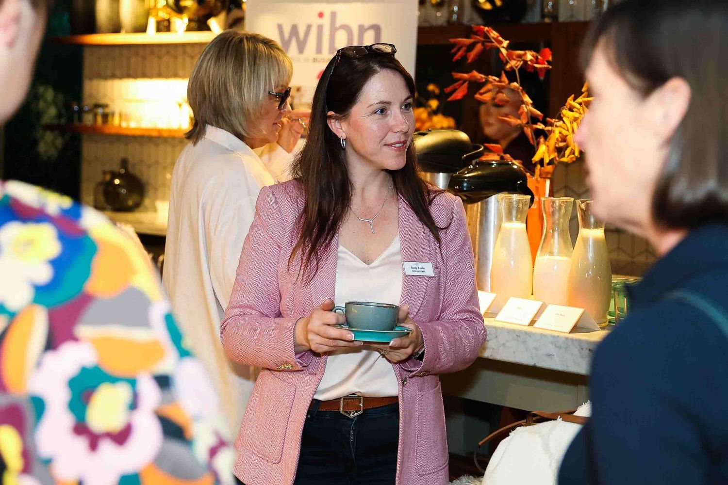 Women in Pink Jacket with a coffee
