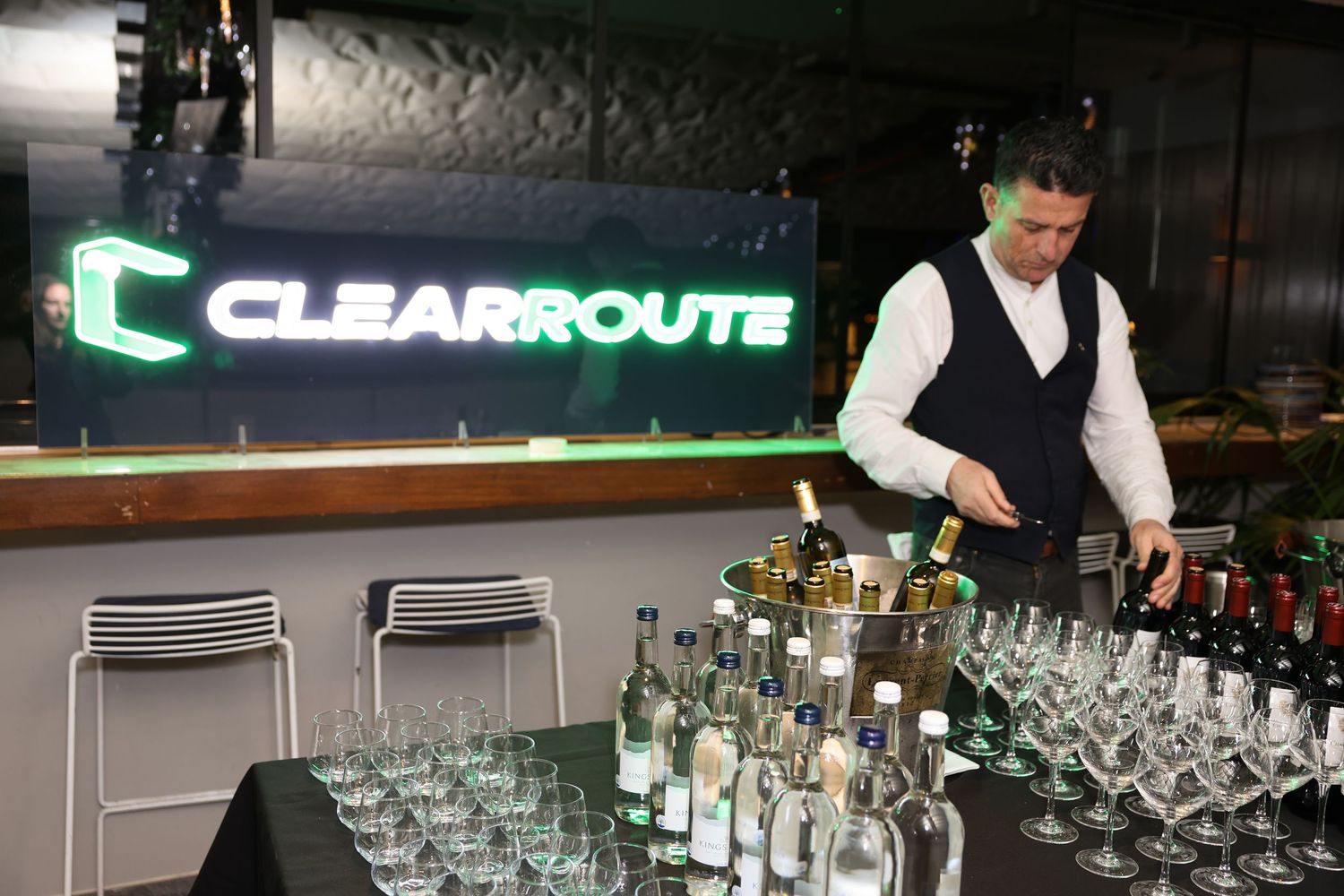 ClearRoute banner with a waiter and a stocked bar