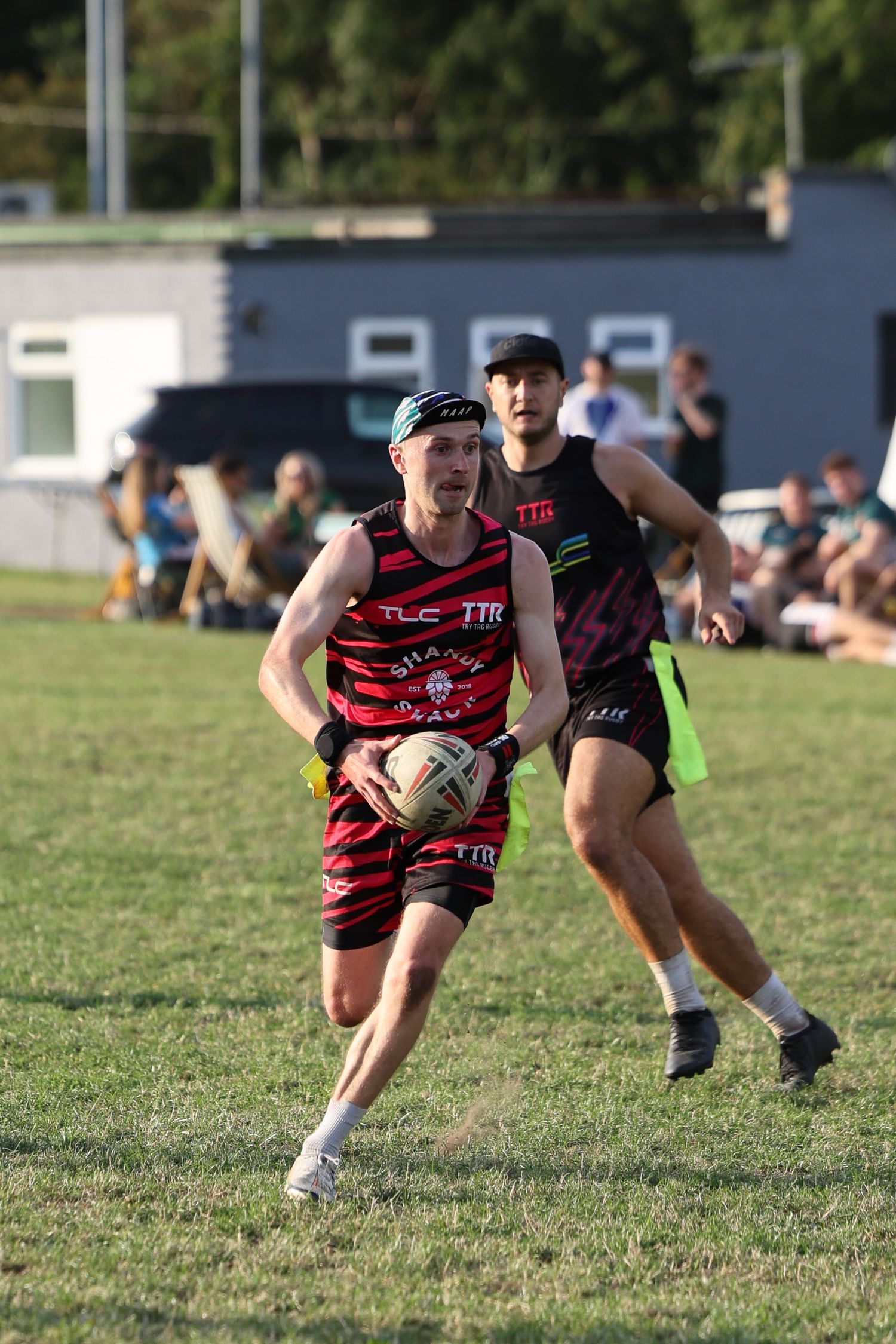 man running with rugny ball