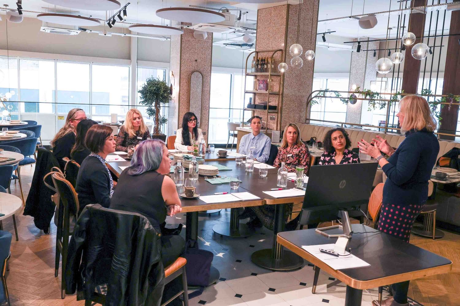 women sat around at a networking meeting