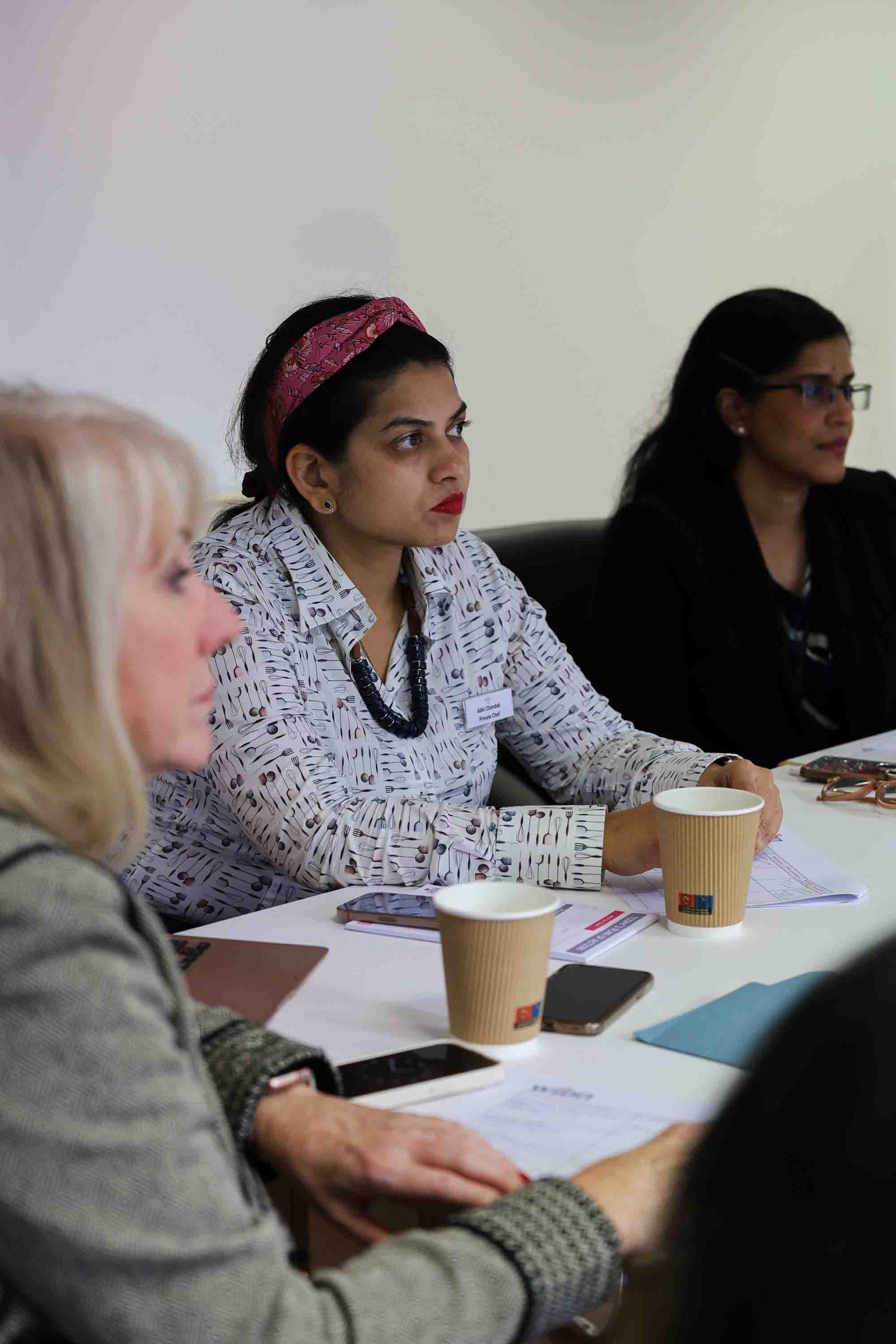 3 female member at a business meeting