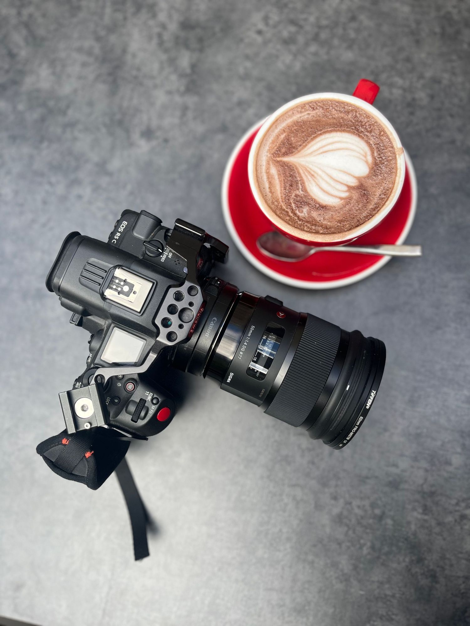 birds eye view of a camera and a coffee mug