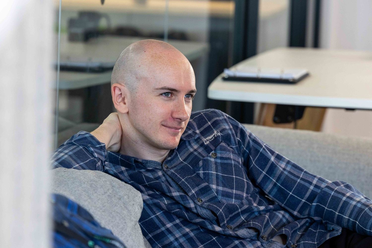 A man leaning on the sofa