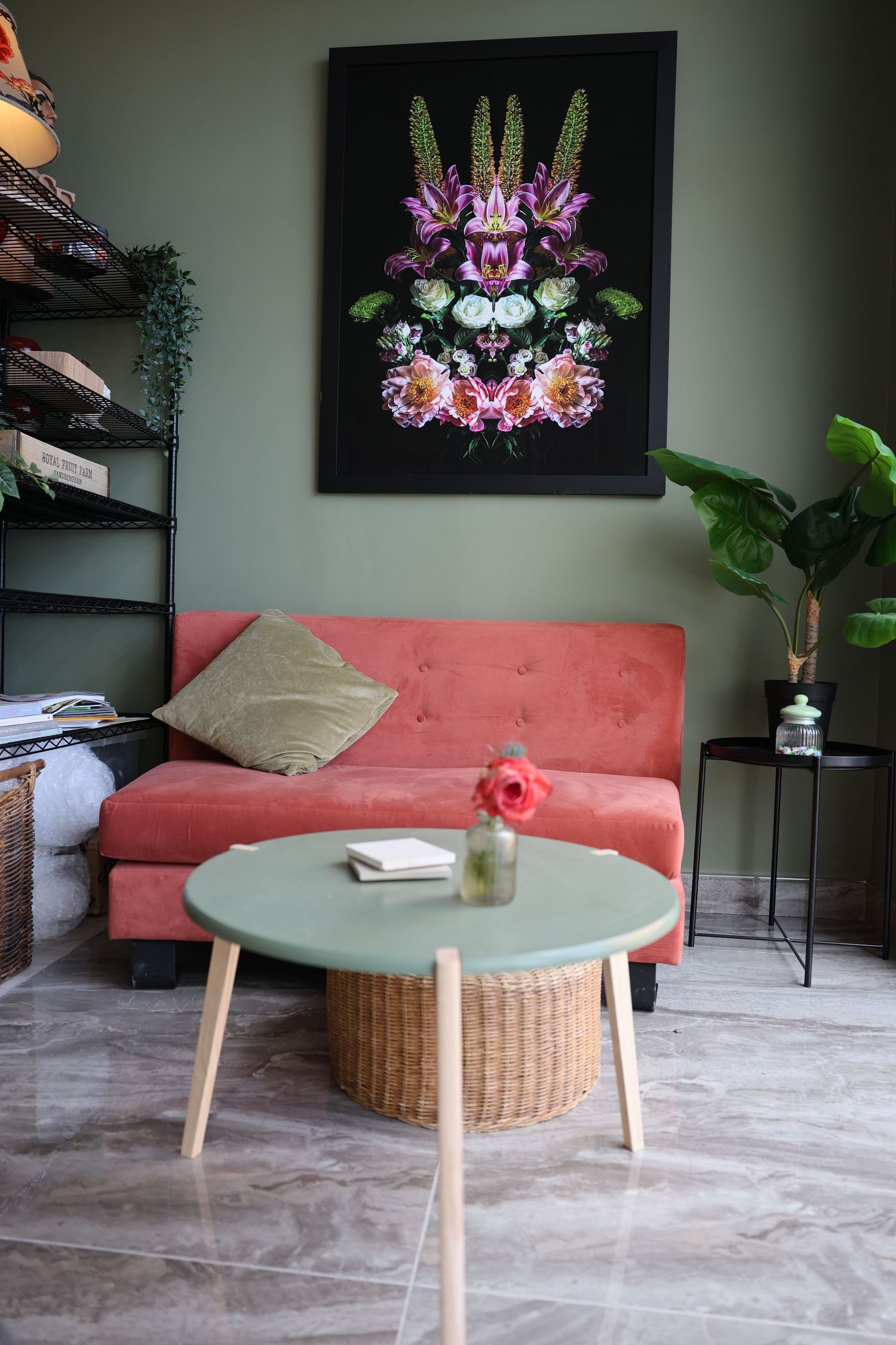sofa and a green wall with a table in the middle
