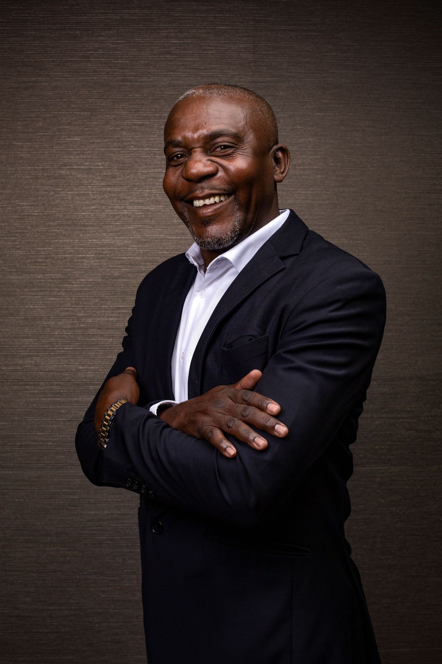 Professional photo series showing confident poses in business attire against textured background.