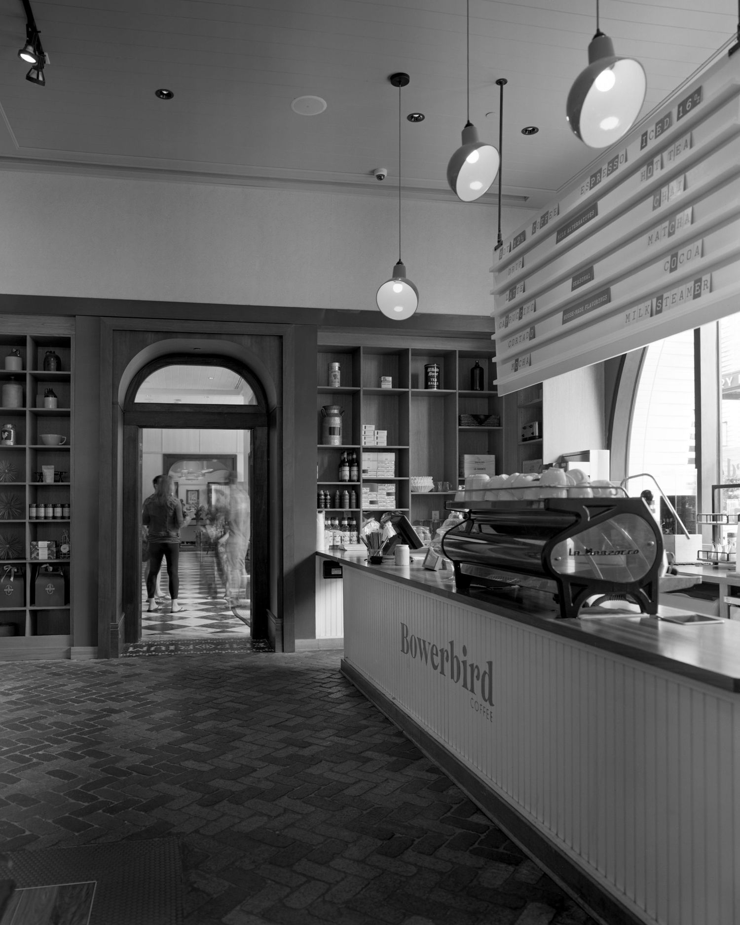 Luxury Savannah hotel cafe with high contrast and natural lighting.