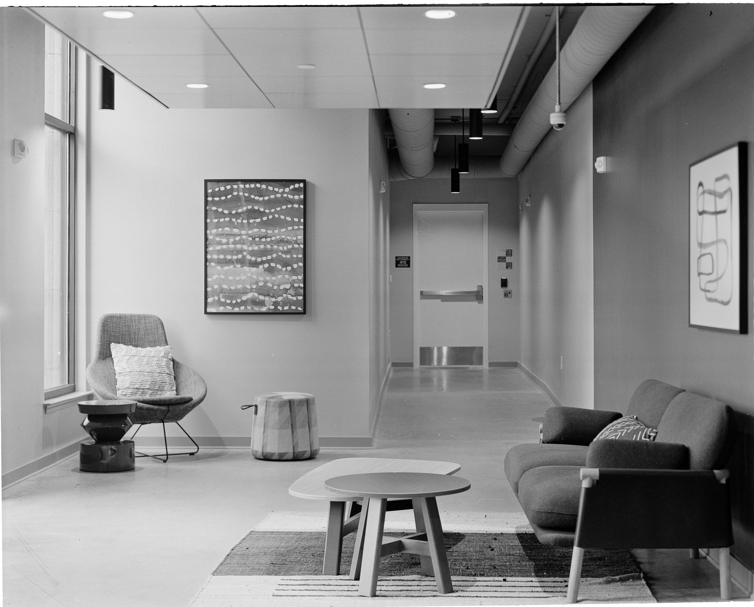 Luxury Savannah apartment lounge space with natural light and minimalist decor.