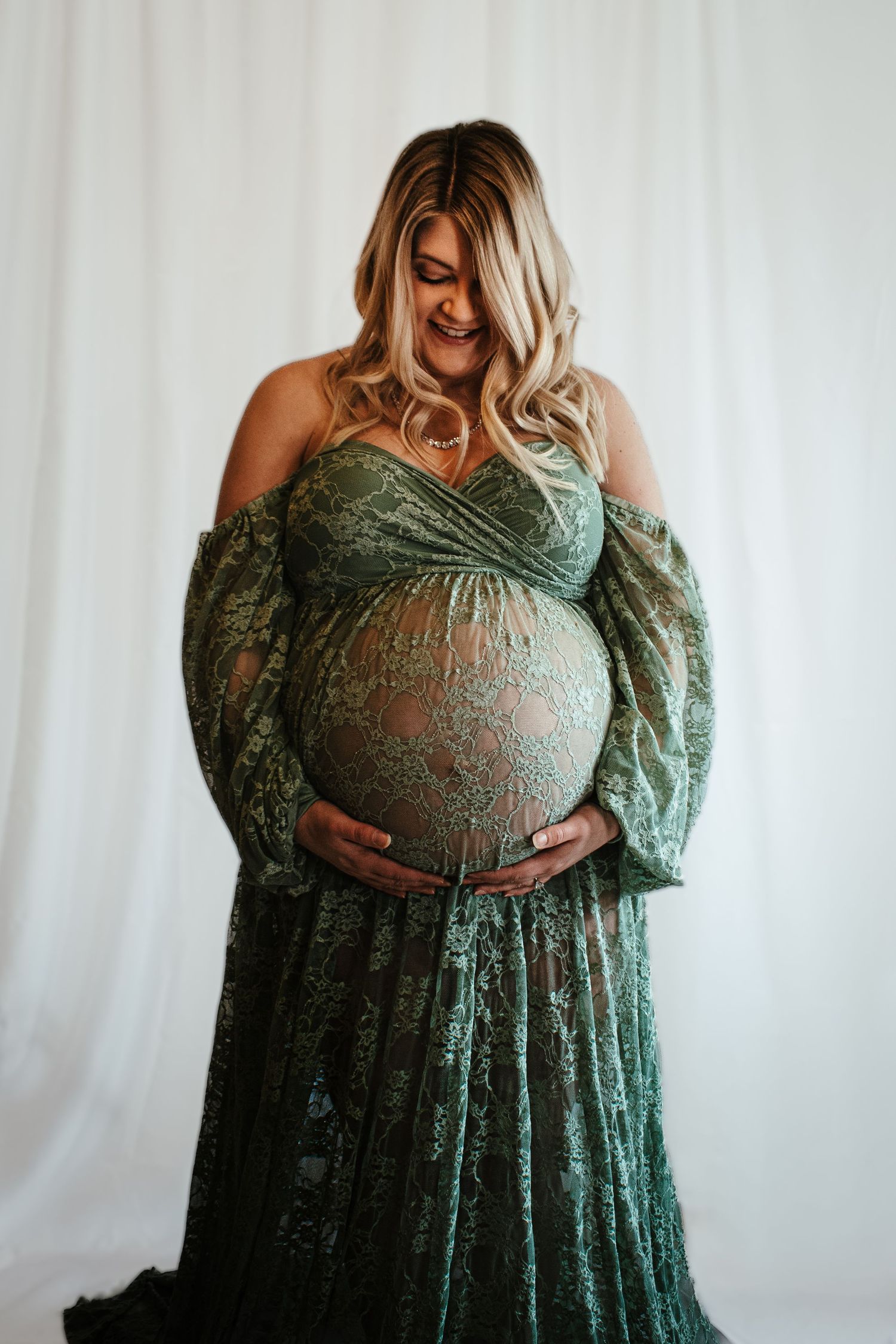 maternity photography green dress white background