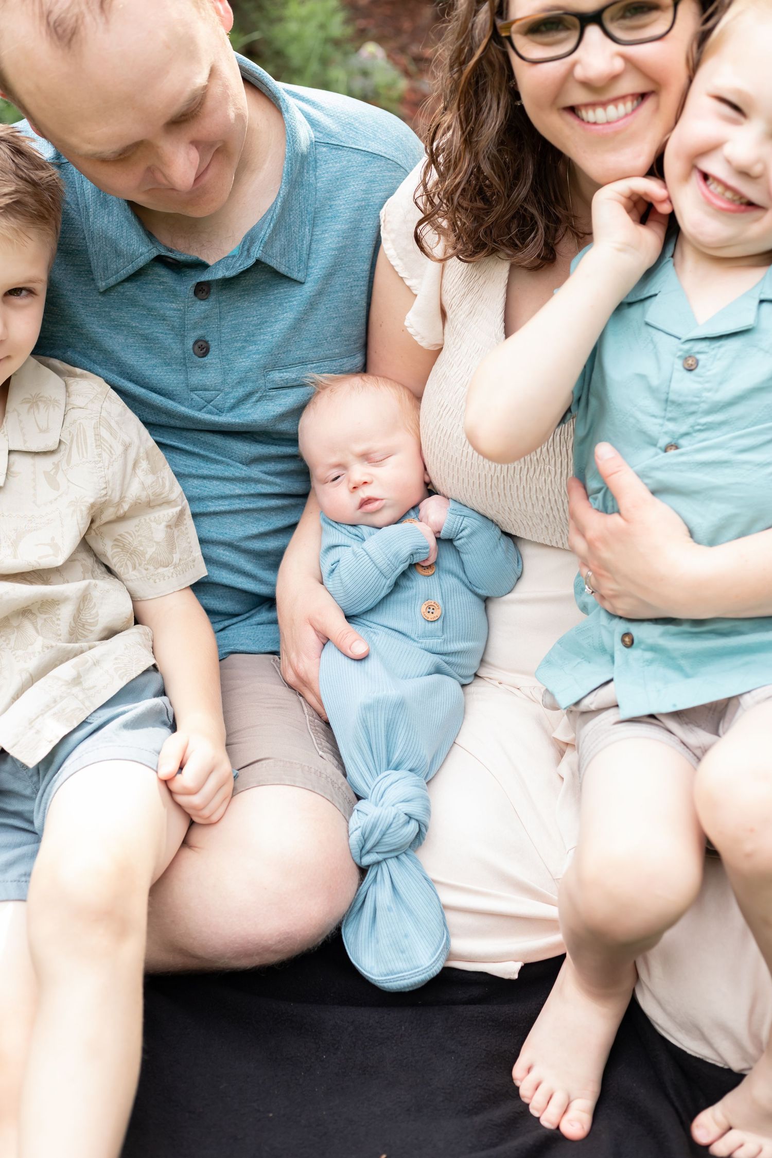family surrounding newborn