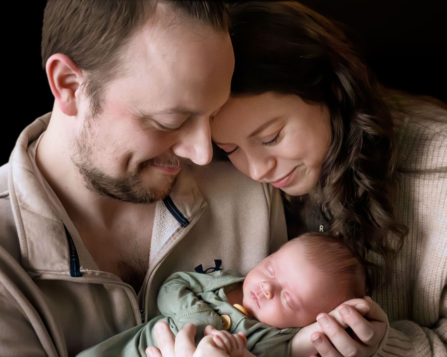 Tender black and white photo series showing parents bonding with their newborn baby in intimate close-up moments.