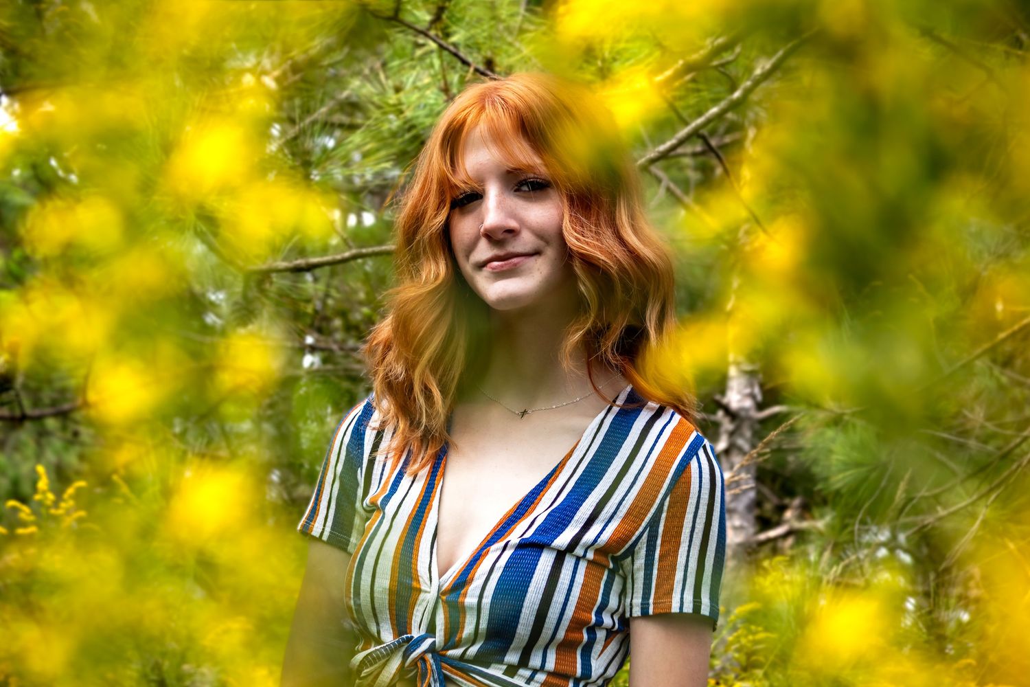 senior photography, looking through yellow flowers