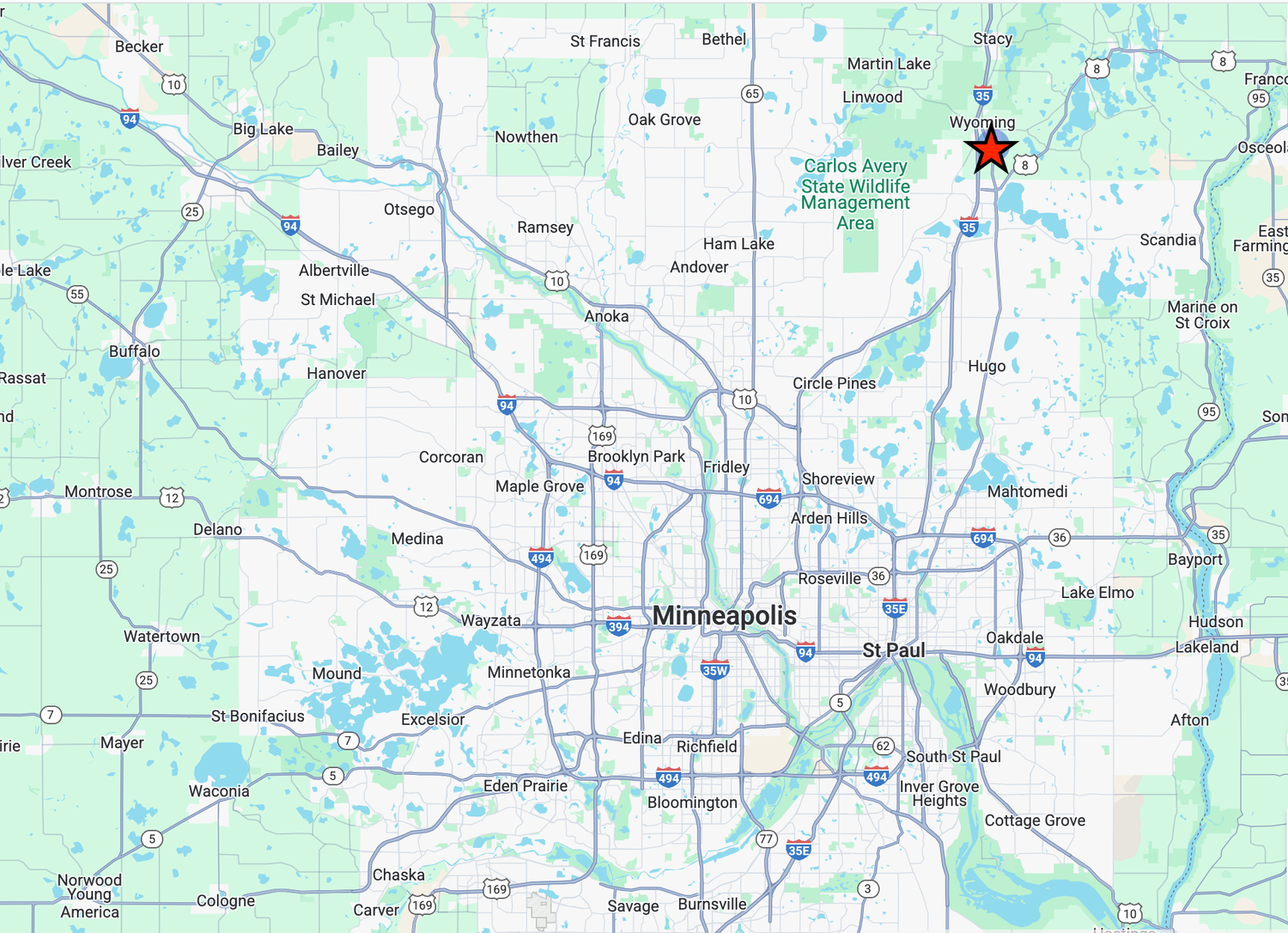 Topographical map showing roads, lakes, and terrain features with a red star marker in the upper right corner.