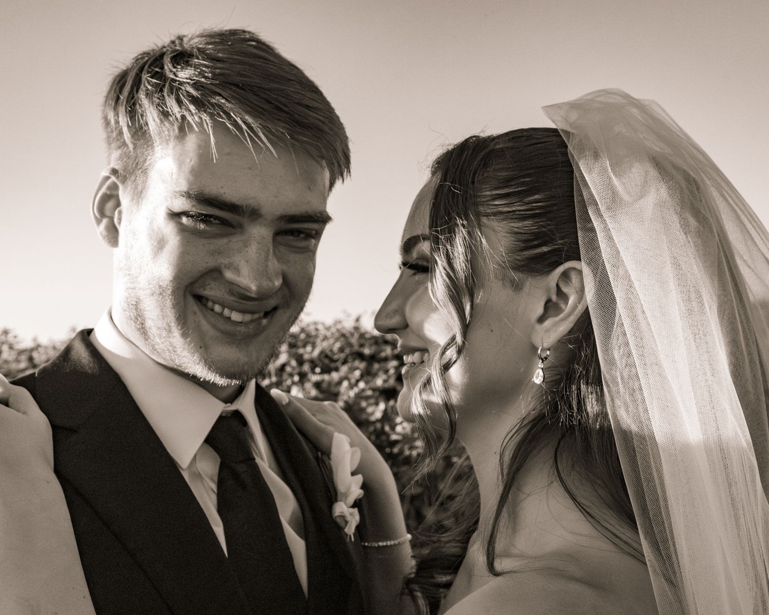 Sepia toned panoramic sequence of tender wedding couple moments.