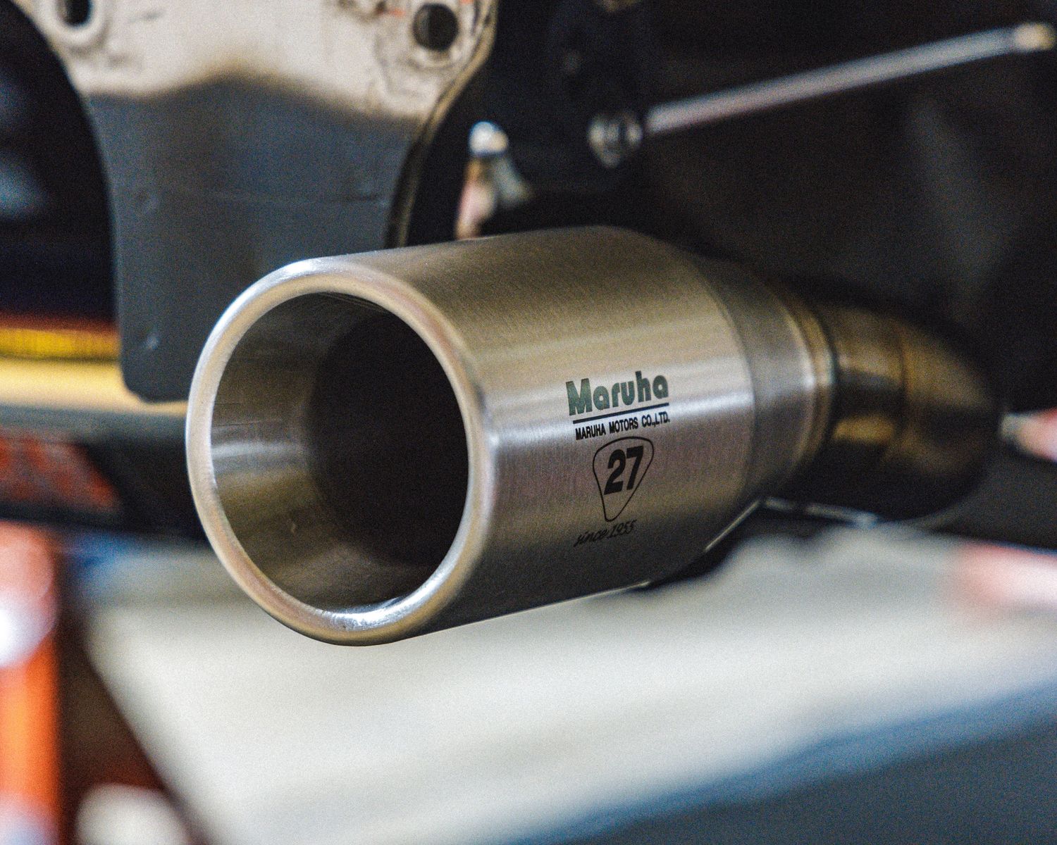 Close-up of titanium exhaust system components on a high-performance vehicle.