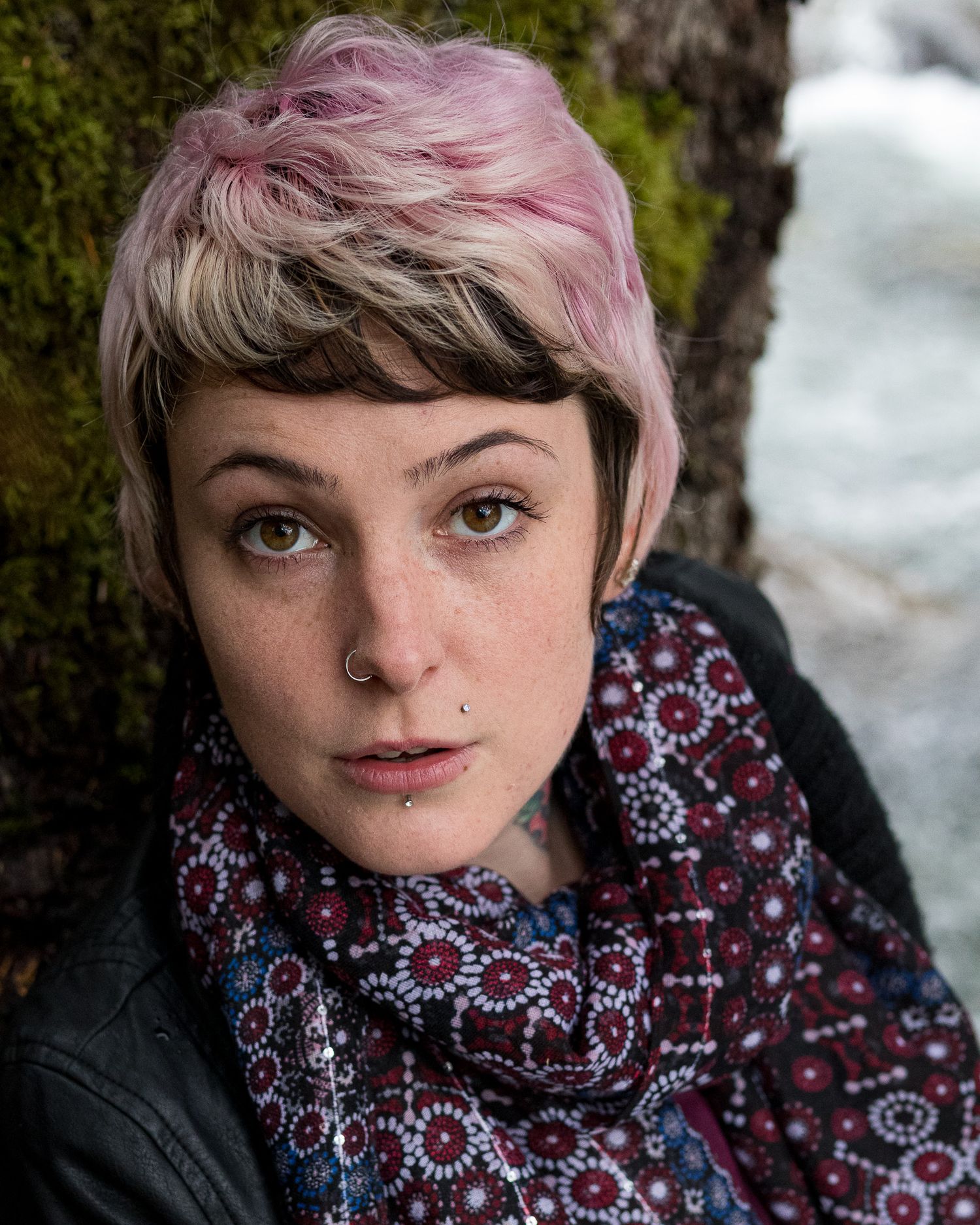 Winter portraits featuring pink hair and a patterned scarf against a snowy background.
