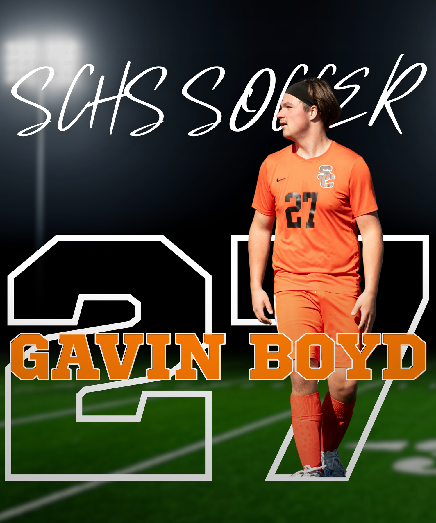 Soccer player in orange jersey stands on field during match against dark background.