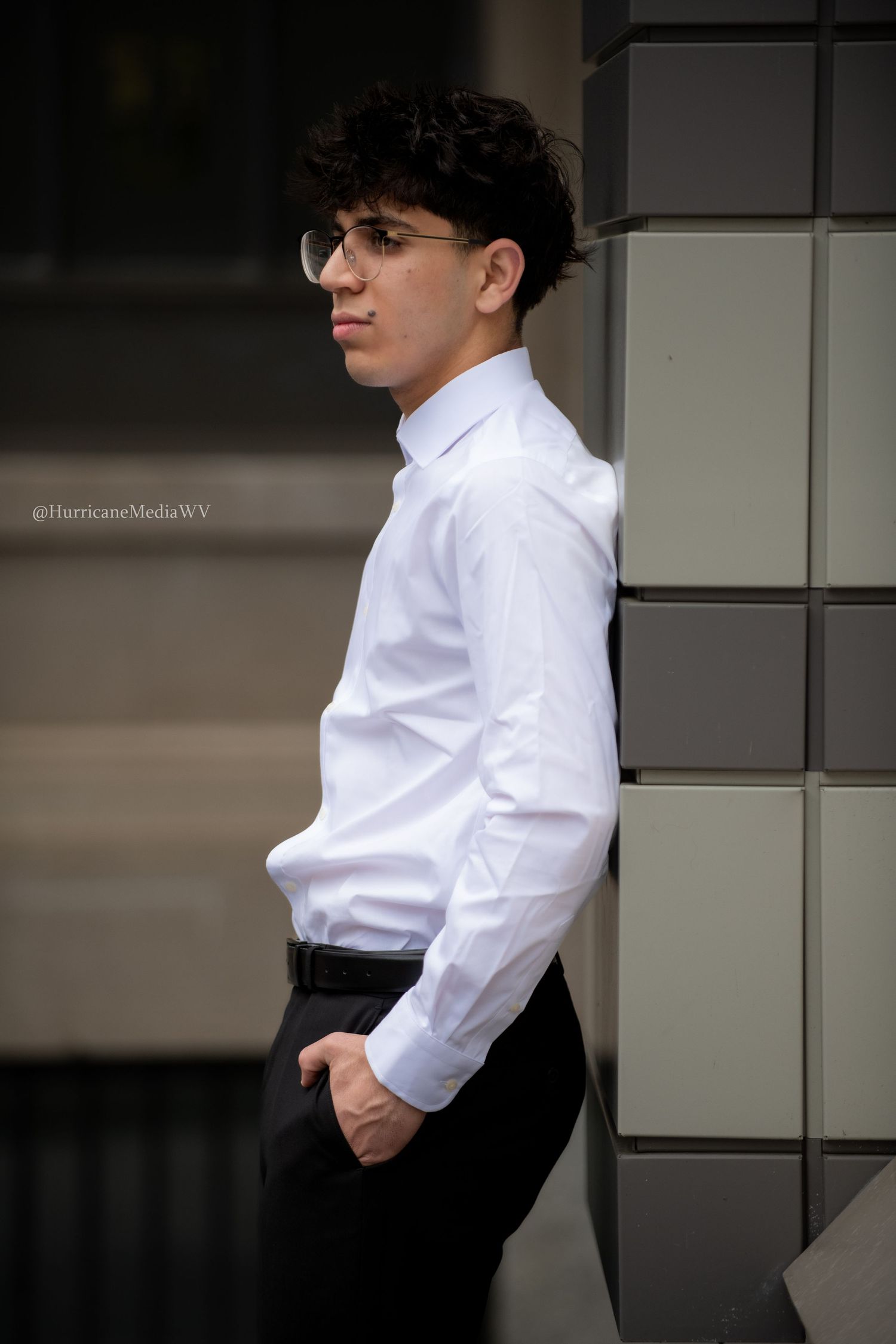 Artistic black and white portraits showing formal attire against modern building facade.