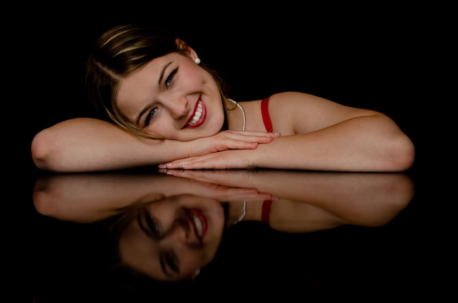 A series of six similar black and white portrait shots showing playful expressions and poses.