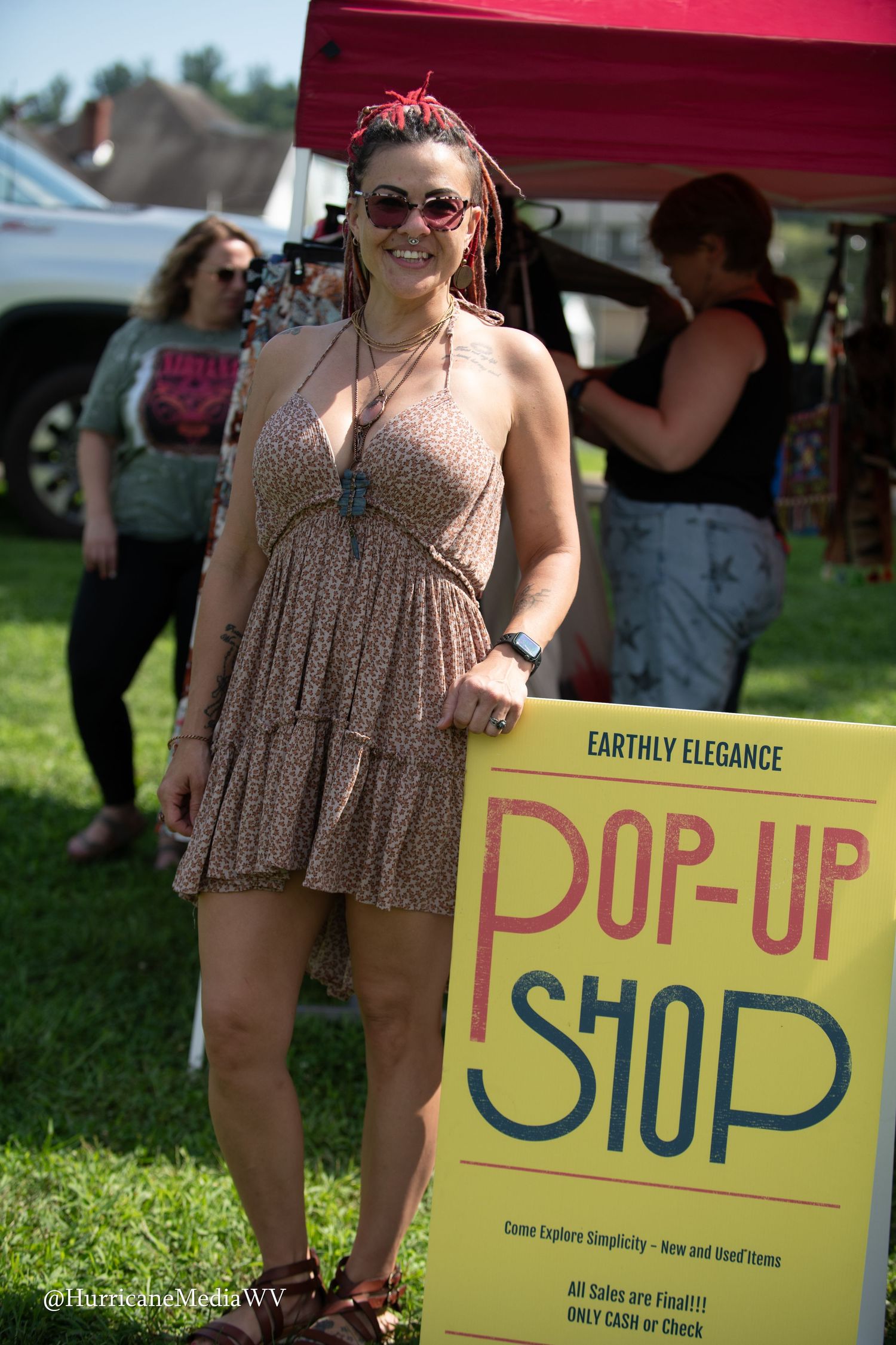 A sequence showing a woman in a floral dress at a craft fair holding up a yellow sign with 'POP-UP' text.