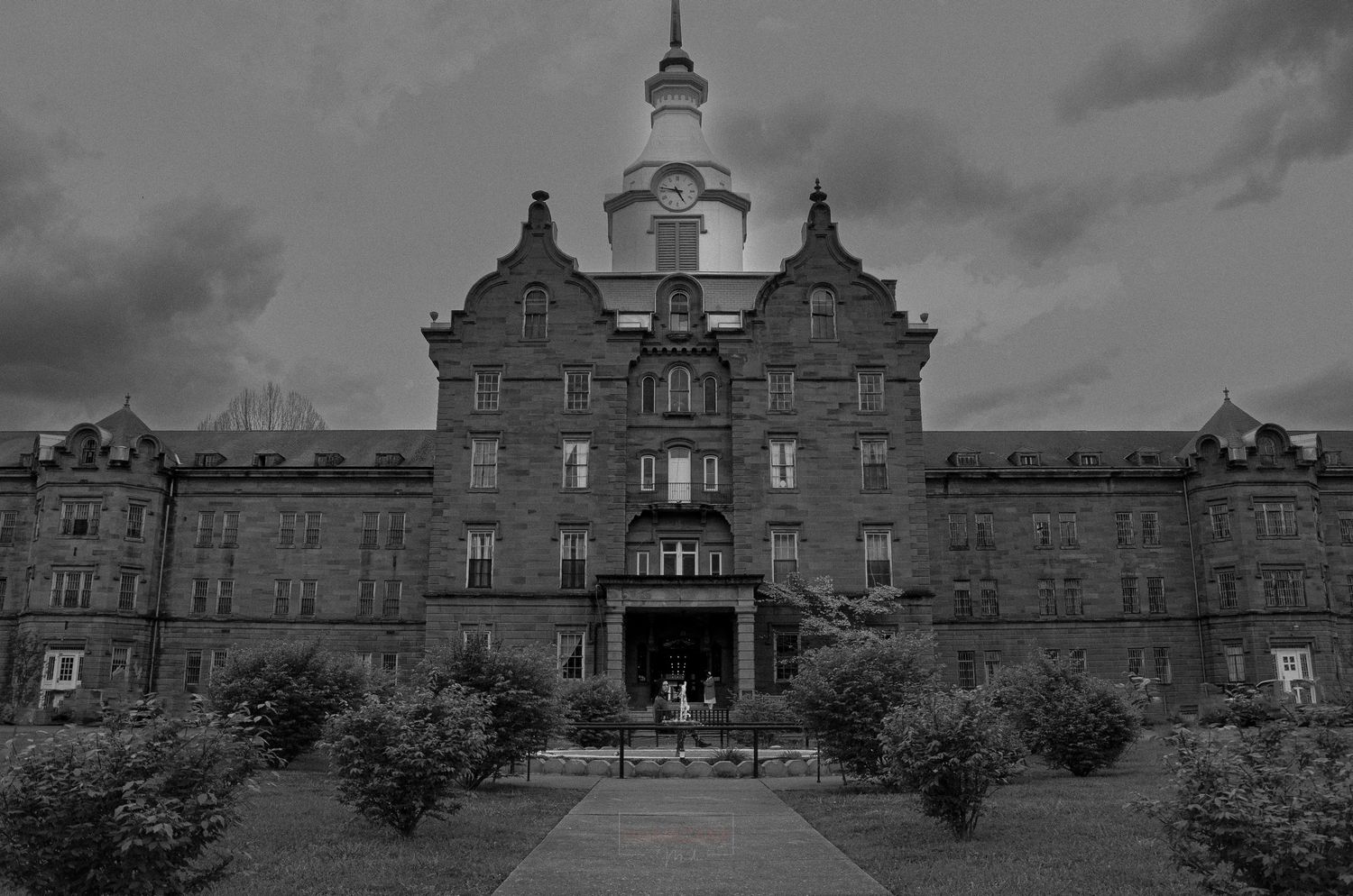 Historic gothic style building exterior with symmetrical architecture in black and white.