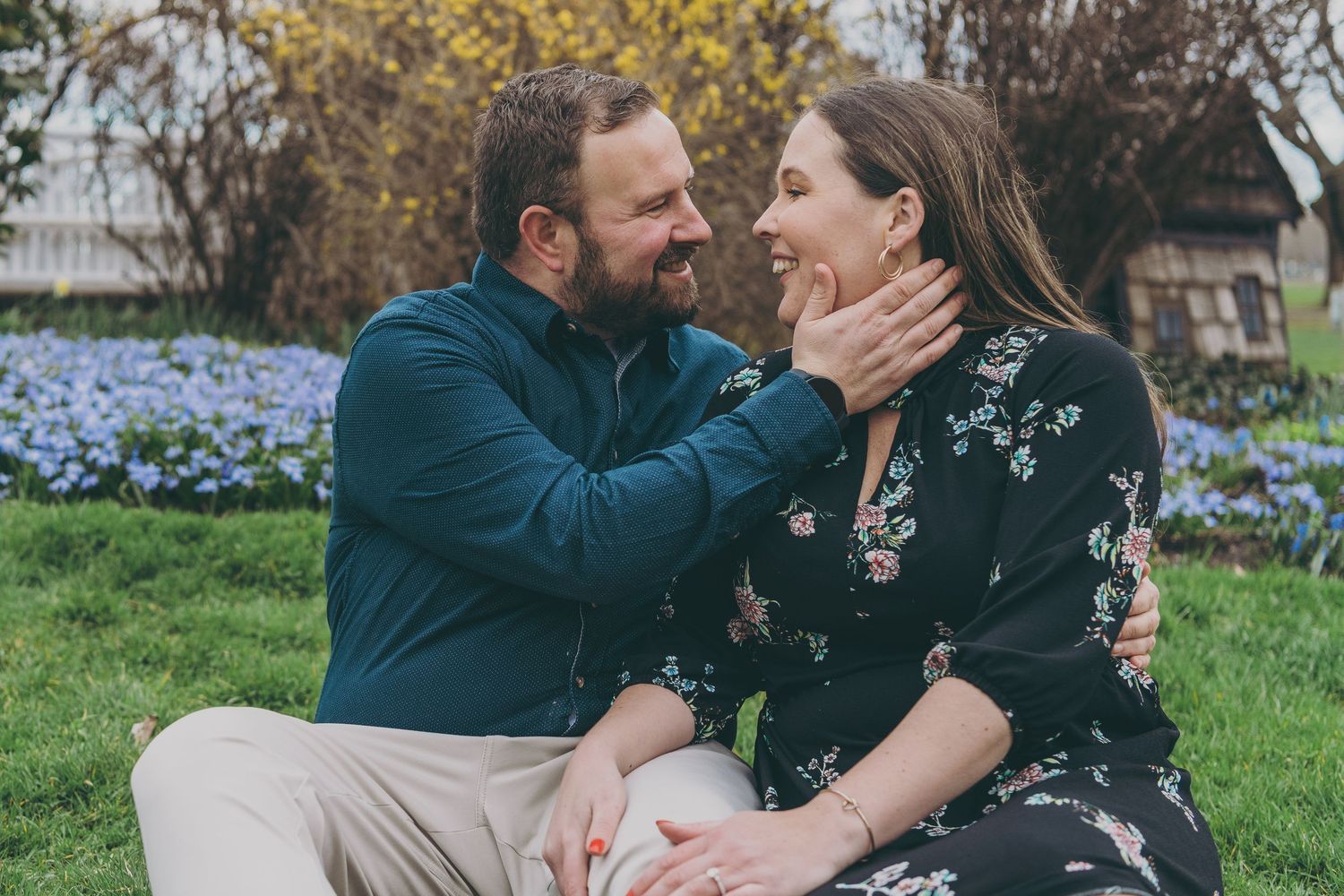 Series of intimate photos showing a couple embracing and sharing joyful moments in a natural outdoor setting.